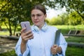 Business woman caucasian girl lady female student looking in mobile phone feels shock upset worries about bad news Royalty Free Stock Photo