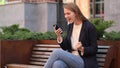 Business Woman Celebrating Success while Using Smartphone Royalty Free Stock Photo