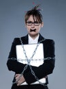 Business woman chained to her her computer laptop