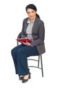 Business woman on chair taking notes Royalty Free Stock Photo