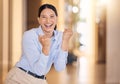 Business woman cheering with fist for success, winning and bonus achievement in startup agency. Portrait of happy, lucky