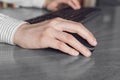 Business woman clicking mouse and typing on keyboard