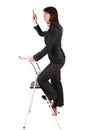 Business woman climbing ladder Royalty Free Stock Photo