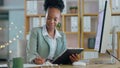Business woman, computer and writing with tablet in office, planning and thinking with smile for strategy. African
