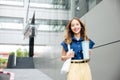 business woman confident smiling with cloth bag holding steel thermos tumbler