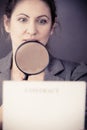 Business woman with contract and loupe Royalty Free Stock Photo