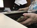 Business woman counting a stack of mexican peso 200 and 500 money bills Royalty Free Stock Photo