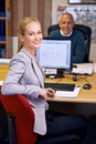 Business woman, desk and coworking portrait with office administrator and secretary at company. Assistant, computer and Royalty Free Stock Photo