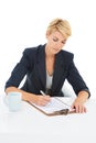 Business woman, documents and writing in studio with legal information, checklist or review of rules and job policy Royalty Free Stock Photo
