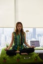 Business Woman Doing Yoga Meditation On Table In Office Royalty Free Stock Photo