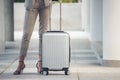 Business woman Dragging suitcase luggage bag,walk to passenger boarding in Airport.Working woman travel to work,wear suit pull Royalty Free Stock Photo