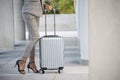 Business woman Dragging suitcase luggage bag,walking to passenger boarding in Airport.Working young woman travel to work.Asian Royalty Free Stock Photo