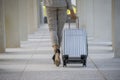 Business woman Dragging suitcase luggage bag,walking to passenger boarding in Airport.Working young woman travel to work.Asian Royalty Free Stock Photo