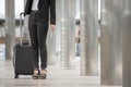 Business woman  Dragging suitcase luggage bag,walking to passenger boarding in Airport.Working young woman travel to work.Asian Royalty Free Stock Photo