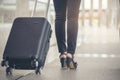 Business woman  Dragging suitcase luggage bag,walking to passenger boarding in Airport.Working young woman travel to work.Asian Royalty Free Stock Photo