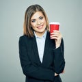 Business woman dressed offise style suit smiling and hold red c Royalty Free Stock Photo