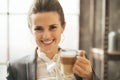 Business woman drinking coffee latte in loft Royalty Free Stock Photo