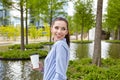 Business woman drinking coffee in a park Royalty Free Stock Photo