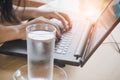 Business woman drinking fresh water while working on computer Royalty Free Stock Photo