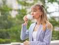 Business woman drinking tea during the break at work