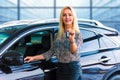 Business woman driver holding auto keys in front of car Royalty Free Stock Photo