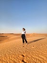 Business woman at Dubai desert barefoot at the sand Royalty Free Stock Photo