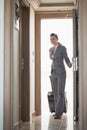 Business woman entering hotel room Royalty Free Stock Photo