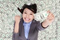 Business woman excited lying on money bed Royalty Free Stock Photo