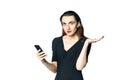 Business woman fatal woman in a black dress with red lipstick looks at her phone, isolated on a white background Royalty Free Stock Photo