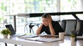 Business woman feeling shocked and stressed after reading business sale performance