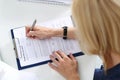 Business woman filling partnership agreement blank