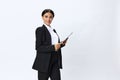 Business woman folder with documents in black business suit shows signals gestures and emotions on white background Royalty Free Stock Photo