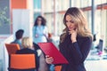 Business woman with folders standing and team mates working in meeting room at office. Royalty Free Stock Photo