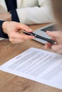 Business woman giving pen to businessman ready to sign contract. Success communication at meeting or negotiation Royalty Free Stock Photo