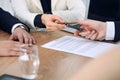 Business woman giving pen to businessman ready to sign contract. Success communication at meeting or negotiation Royalty Free Stock Photo