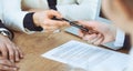 Business woman giving pen to businessman ready to sign contract. Success communication at meeting or negotiation Royalty Free Stock Photo