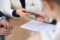 Business woman giving pen to businessman ready to sign contract. Success communication at meeting or negotiation