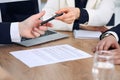 Business woman giving pen to businessman ready to sign contract. Success communication at meeting or negotiation Royalty Free Stock Photo