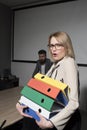 Business woman in glasses hold file folders. secretary with office documents. Surprised woman and bearded man on Royalty Free Stock Photo