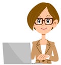 Business woman with glasses operating a personal computer