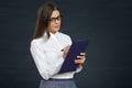 Business woman glasses wearing writing on clipboard. Royalty Free Stock Photo