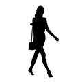 Business woman goes with small handbag on her shoulder, isolated vector silhouette, side view
