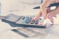 Business woman hand calculating her monthly expenses with credit card, idea for shopping online Royalty Free Stock Photo