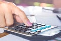 business woman hand calculating her monthly expenses during tax season. Royalty Free Stock Photo