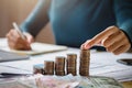 business woman hand holding coins to stack on desk concept saving money finance Royalty Free Stock Photo