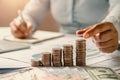 business woman hand holding coins to stack on desk concept saving money finance Royalty Free Stock Photo