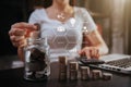 Business woman hand holding coins to stack on desk concept saving money finance and accounting Royalty Free Stock Photo