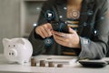 Business woman hand holding coins to stack on desk concept saving money finance and accounting Royalty Free Stock Photo