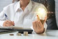 Business woman hand holding light bulb have a new ideas Royalty Free Stock Photo