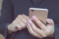 Business woman hand holding mobile phone connecting to internet